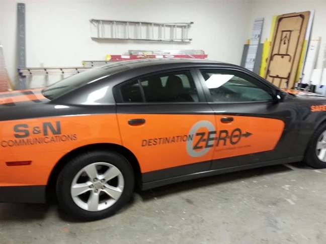 Orange color change vinyl and cut vinyl graphics make this Charger a big hit with their employees.  I think that the orange makes the car go FASTER!