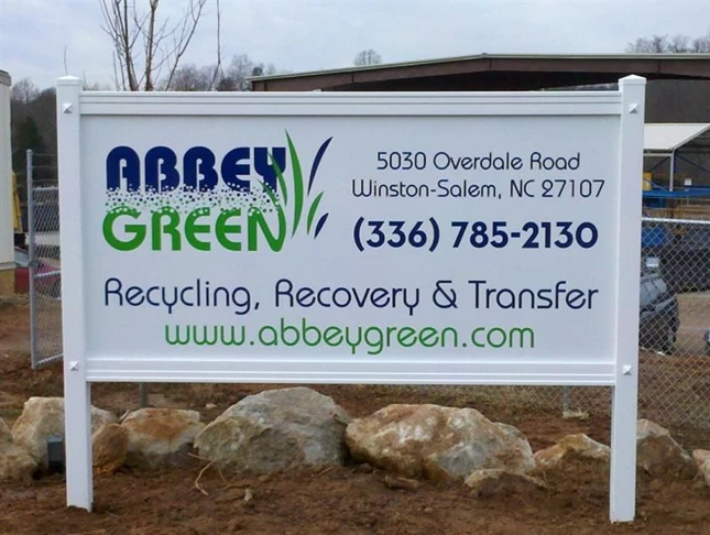 Maintenance-free PVC sign frame with a cut vinyl/ composite aluminum sign panel.  Reasonably priced and good looking too.